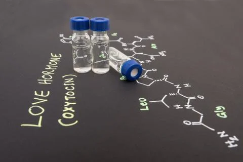 Close-up blue cap sample vial on paper with chemical formula of Oxytocin (l.. Stock Photos