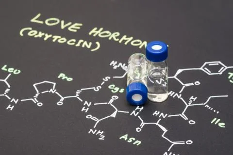 Close-up blue cap sample vial on paper with chemical formula of Oxytocin (l.. Stock Photos