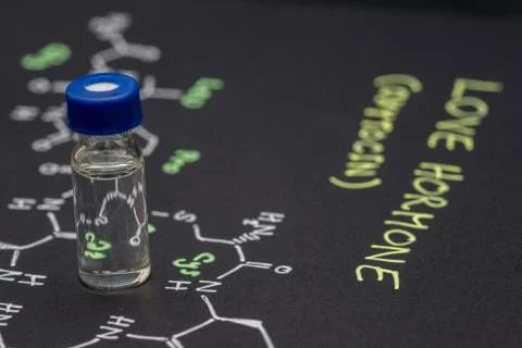 Close-up blue cap sample vial on paper with chemical formula of Oxytocin (l.. Stock Photos