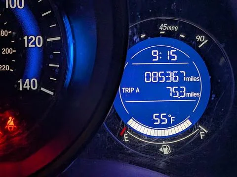 Close-up of a blue car dashboard odometer and fuel gauge Photos