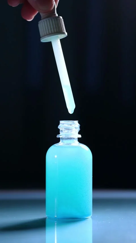 Close up of Blue Copper Peptides GHK-Cu in Pipette. Beauty serum for anti aging Stock Footage 327861242