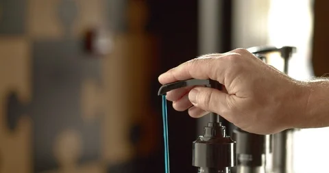 Close-up of blue curacao syrup being poured from bottle. 4K Slow Motion Stock Footage 116159362