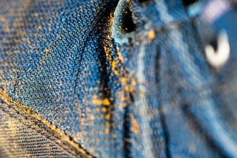 Close-Up Of Blue Denim Boot Texture With Yellow Dust Foto stock