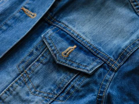 Close-up of a blue denim jacket. Focus on pocket Stock Photos