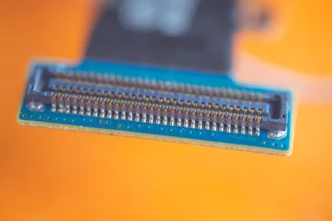 Close up of blue electronic circuit connector with rows of metallic contact.. Stock-Fotos