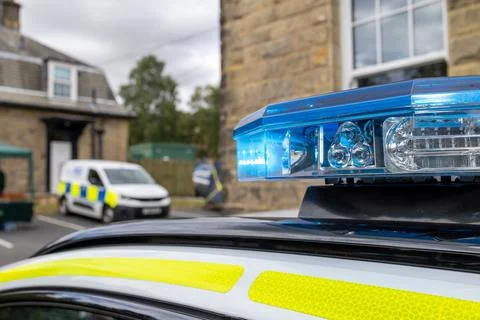 Close up of a blue emergency light bar mounted on the roof of a British pol.. Stock-Fotos
