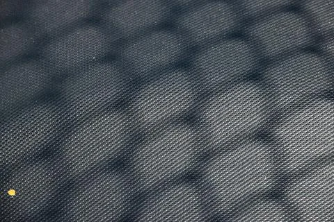A close up of a blue fabric with a pattern of circles Foto stock