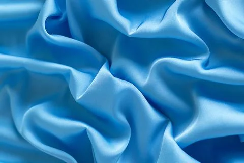 Close-up of blue fabric texture with soft folds and flowing design Stock Photos