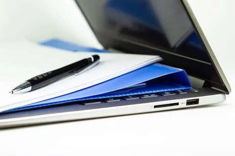 Close Up Blue file folder and Laptop Computer on desk in meeting room Stock Photos