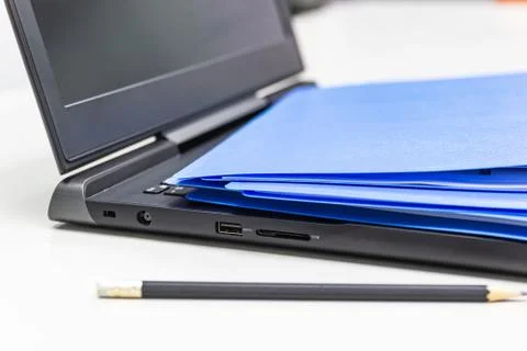 Close Up Blue file folder and Laptop Computer on desk in meeting room Stock Photos
