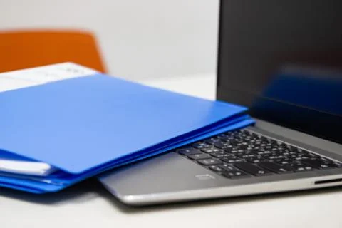 Close Up Blue file folder and Laptop Computer on desk in meeting room 스톡 사진