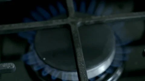 Close Up of Blue Flame Burning on a Gas Stove Burner Stock Footage 343089430