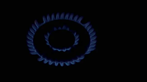 A close-up of the blue flame of a gas burner in a home kitchen, which burns and 스톡 동영상 166206076