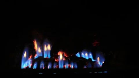 Close up of the blue flame on a gas heat stove Stock Footage 69174451