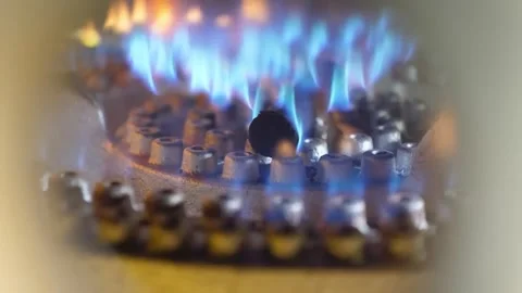 Close-Up of Blue Flames Igniting on a Industrial Gas Burner Ring Stock Footage 345692470