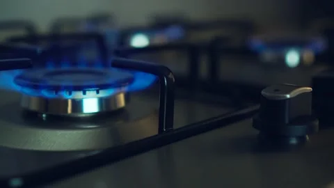 Close up of blue gas flames burning on stove Stock Footage 204854043