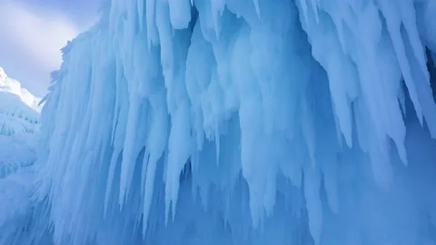 Close up of the blue icicles reflecting the sky, taken at an elevated angle. Stock Footage 159572377