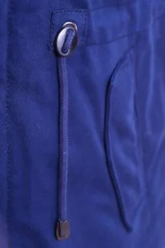 Close up of blue jacket pocket , winter fashion outfit. Jacket isolated on wh Foto stock