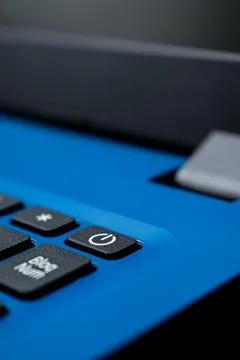 Close-Up Of Blue Keyboard With Power Button Foto stock