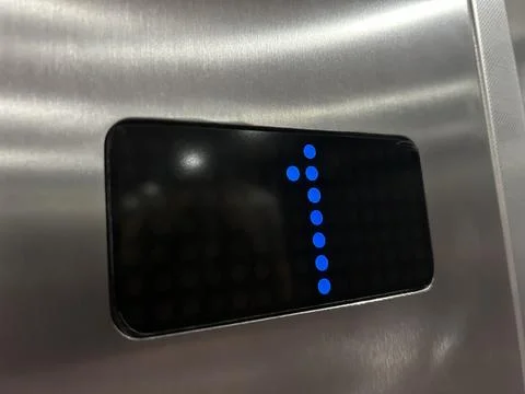 Close-Up Of Blue LED Indicator Dots With Number 1 On Black Digital Pane Foto stock