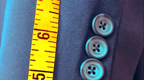 Close up of blue men's suit jacket and tailor's tape measure. Stock Footage 48007917