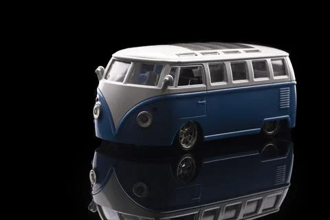 Close up of a blue mini van toy with amazing reflections Stock Photos