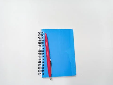 Close Up Blue Note Book or Diary book with red Pen on isolated white backgrou Stock Photos