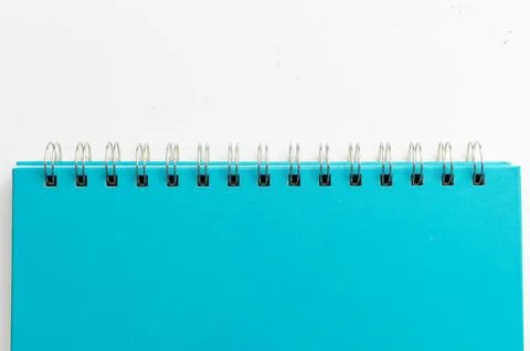 Close-up of a blue notebook with checkered pages. Spiral notebook isolated Stock Photos
