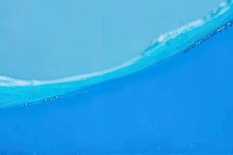 Close-up of blue ocean wave with foam and bubbles Stock Photos
