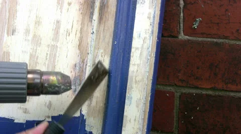 Close up of blue paint being removed from a kitchen cupboard door Video stock 26229708