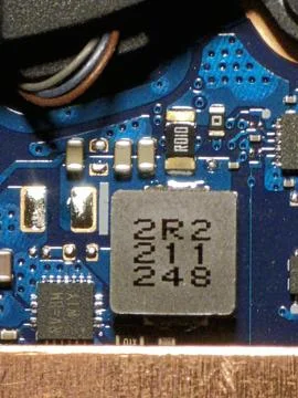 Close-up of blue pcb with large square inductor Stock Photos
