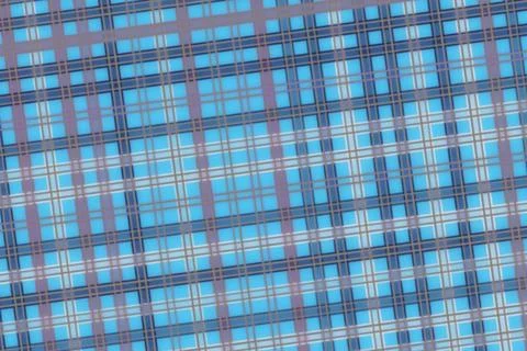 Close-up of blue plaid fabric with grid pattern and texture Stock Photos
