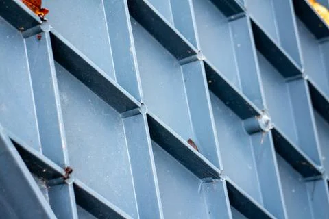 Close-up of a blue plastic grid structure with a geometric diamond pattern Stock Photos