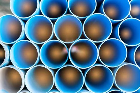 Close up to blue plastic pipe background, PVC pipes stacked in warehouse, 스톡 사진