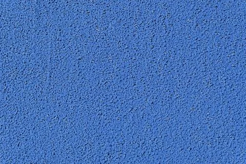 Close up of blue rubber track surface texture, flat lay abstract background Stock Photos