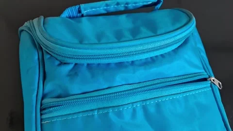 Close-up of a blue school backpack with zippers. Student bag for education and Stock Footage 340480620