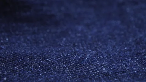 Close up of blue textile jeans texture. Cotton casual clothes. Denim jeans. Stock Footage 315573358