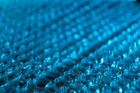 Close up of blue tinted bubble wrap with lmited focus. Stock Photos