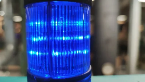Close-up of blue warning light blinking with industrial background, 4k 30 fps Video stock 128667833