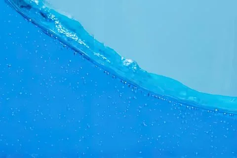 Close-up of blue water with bubbles and wave motion Stock Photos