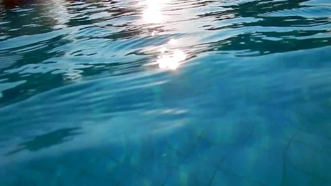 Close up of blue water with sunshine reflections Vídeos de archivo 77138302