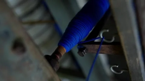 Close-Up of Blue Wool Yarn Bobbin Processing in Textile Mill 스톡 동영상 314705114