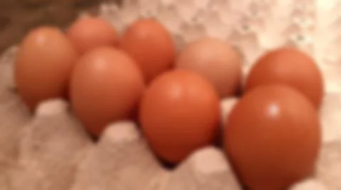 Close-up blurred background of brown box raw chicken eggs concept. Stock-Fotos