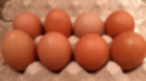 Close-up blurred background of brown box raw chicken eggs concept. Stock Photos