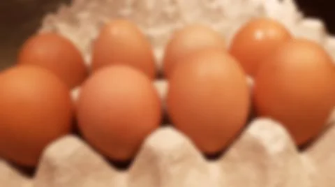 Close-up blurred background of brown box raw chicken eggs concept. Stock-Fotos