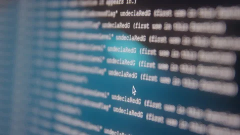 Close up of Blurred Coding Data Scrolling Across Computer Screen at Night Stock Footage 219598235