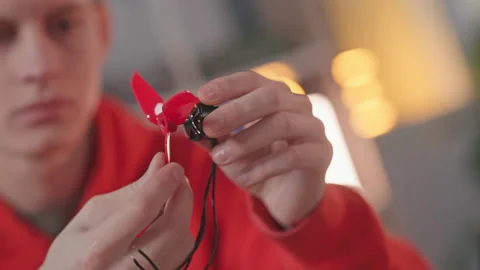 Close-up blurred view of focused professional engineer making electronic first Stock Footage 195276394