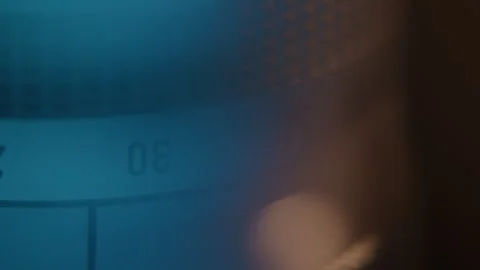 Close up Blurry View of a Spinning Camera Lens with Blue Lighting Stock Footage 270396379