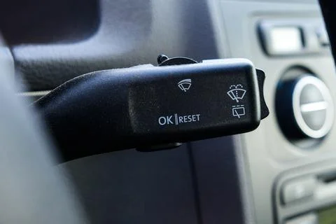 Close-up of on-board computer button and power on wiper in car. Stock Photos