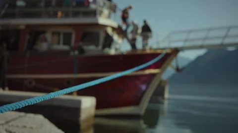 Close-up of the boat is moored to a parking post on the pier and gently sways on Stock Footage 313731685